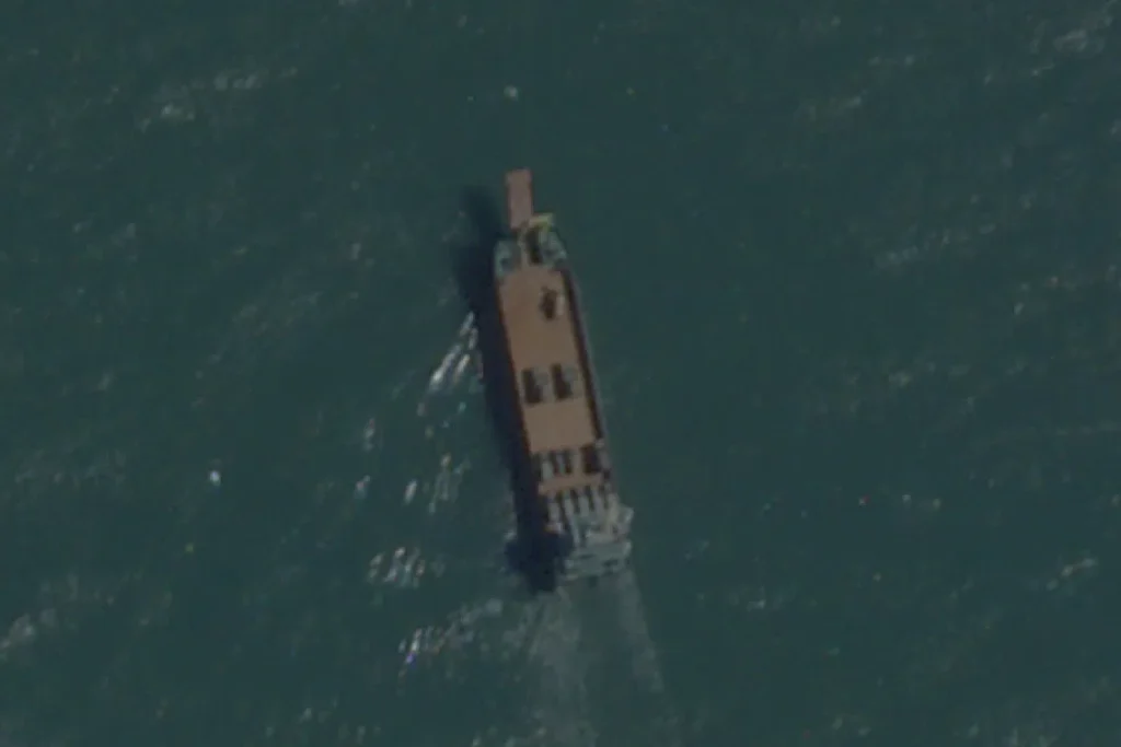 China’s civilian shadow navy practises for invasion of Taiwan FILE PHOTO: A satellite image taken by Planet Labs shows a deck cargo ship, loaded with vehicles, cruising towards the beach near Jiesheng, Guangdong, China July 16, 2025. Planet Labs PBC/Handout via REUTERS/File Photo