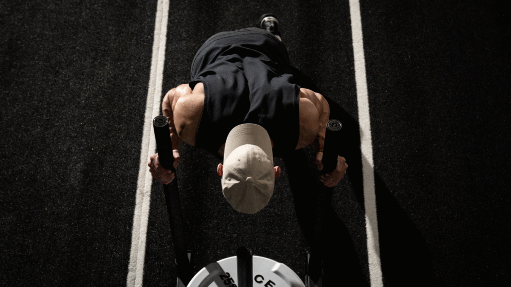 Man pushing sled in HYROX race