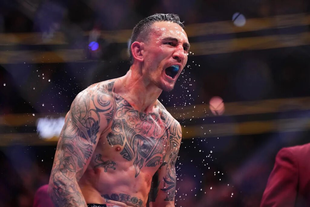 Max Holloway celebrates UFC win