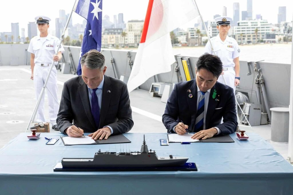 Australian and Japanese officials signing DoI on Upgraded Mogami for Australia