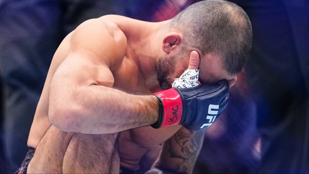 Alexandre Pantoja reacts after his loss to Joshua Van at UFC 323