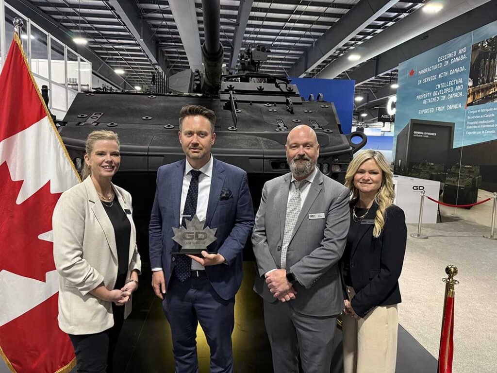 Left to right. Christa Hammond (GDLS–Canada), James Kempston (NP Aerospace), Pete Jessop (GDLS–Canada), Jen Froggett (GDLS–Canada) at the CANSEC defence and security event in Ottawa, Canada, in May 2026.[Photo © Copyright of NP Aerospace]