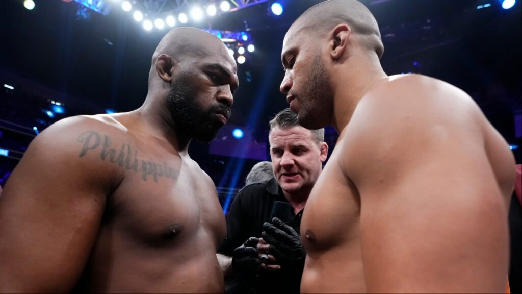 Jon Jones and Ciryl Gane face off in the cage at UFC 285