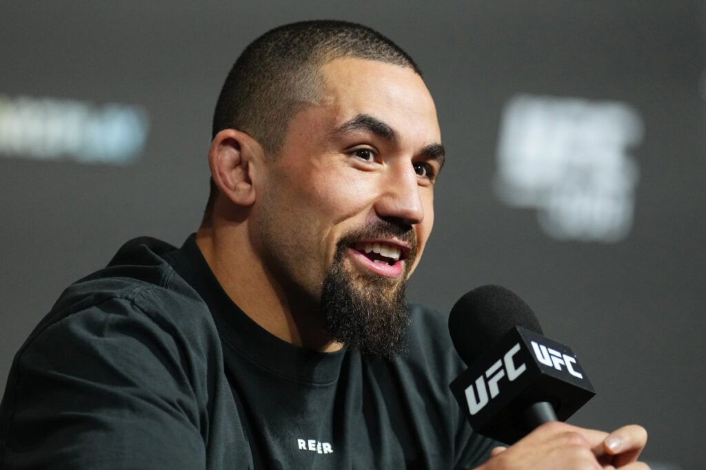 Robert Whittaker answers questions from media members before a UFC event