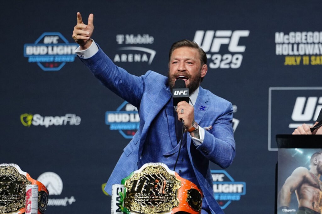 Conor McGregor motivated by two UFC legends amid second ACL surgery: “The Mac is back, baby” Conor McGregor fires up the crowd during a press conference for UFC 329
