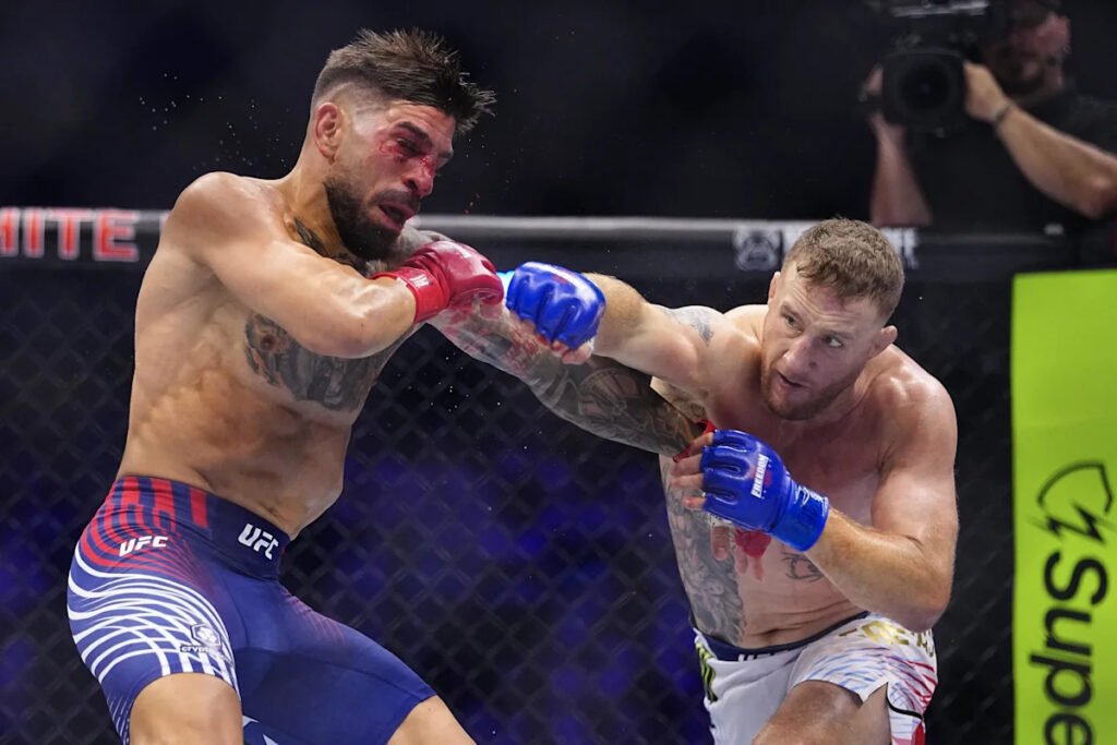 Justin Gaethje lands a punch on Ilia Topuria during UFC Freedom 250 main event