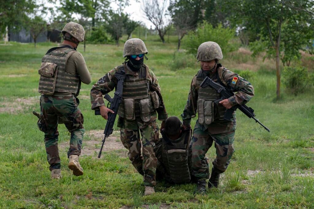 Troops from the 22nd Peacekeeping Battalion Moldovan Land Forces evacuate a casualty during Exercise Sea Breeze 25-1 in Smardan Range, Romania. Romania plays an important role in Moldovan security. (Image: US Marine Corps)